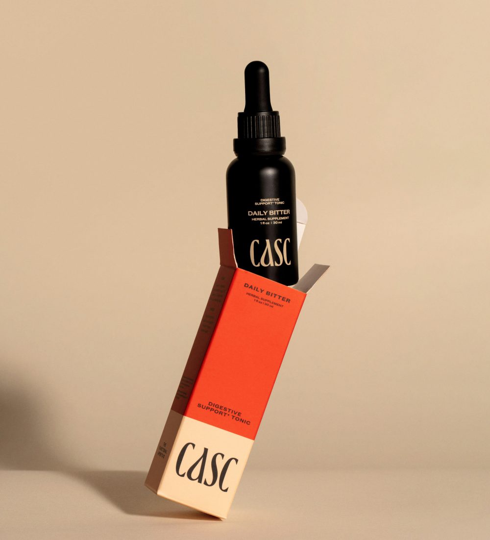 CASC Digestive Support Tonic, Daily Bitter Red Packaging Box with black dropper bottle, cream background