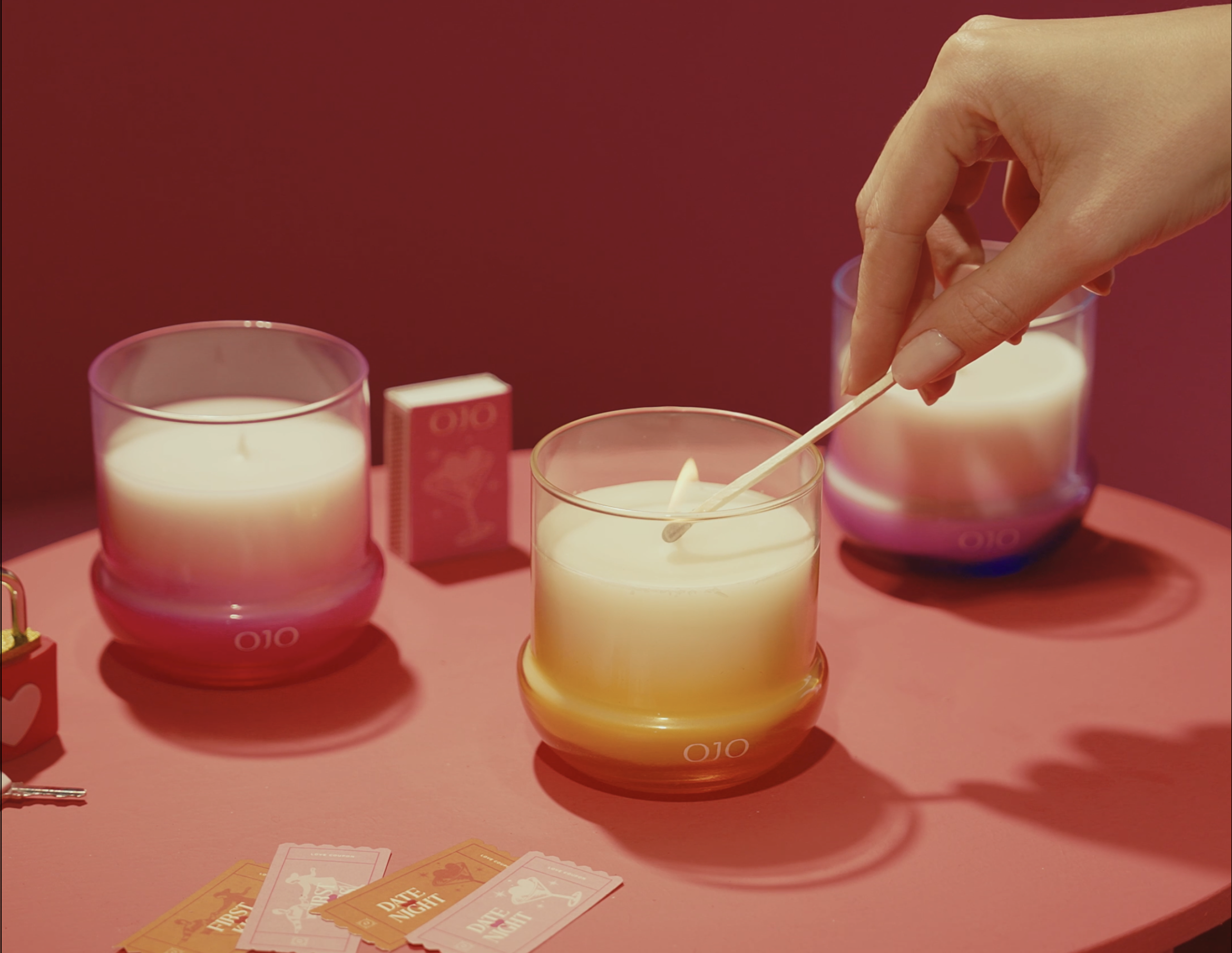 OJO Rhythm of the Heart candle Collection with glass jar and pink background