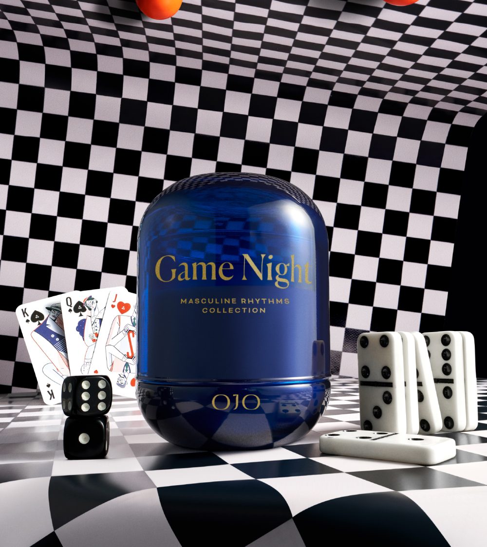 OJO Game Night candle collection with blue glass jar, golden printed typography and checkered background