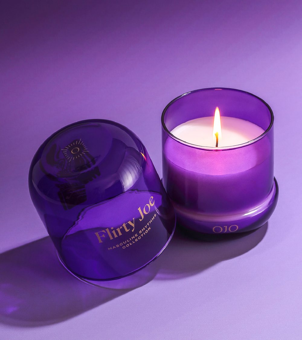 OJO Flirty Joe candle collection with purple glass jar and purple background