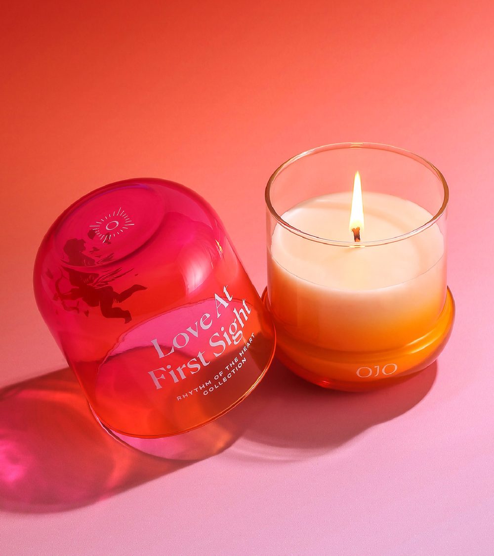 OJO Love at First Sight candle collection with gradient colored glass jars and pink background