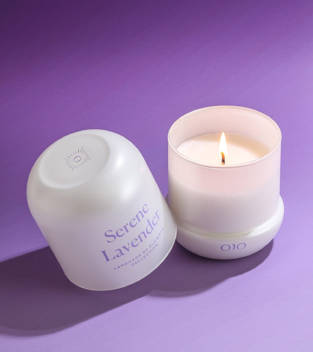 OJO Serene Lavender candle collection with white glass jars and purple background